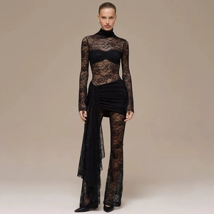 Detailed view of the intricate floral lace texture on the long sleeve bodysuit set