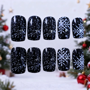 Classic Christmas press-on nails set with elegant white snowflakes on black base