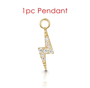 Detailed macro view of a 1pc gold lightning bolt pendant featuring clear zircon inlay