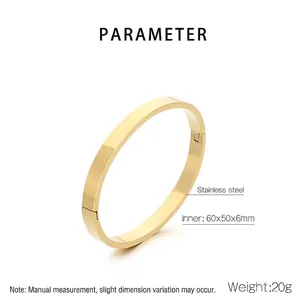 Polished golden stainless steel clasp bangle with 60x50x6mm oval inner dimensions