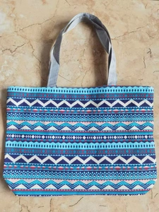 Detailed top view of a large canvas tote bag with colorful Bohemian geometric patterns