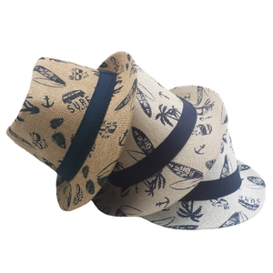 Three summer straw fedora hats with surf patterns and navy ribbons for sun protection