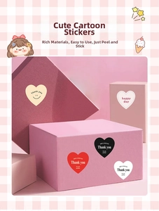 Close-up of heart stickers with Thank You text on gift boxes for packaging decoration