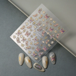 Detail of 5D gold embossed butterfly nail stickers Co-095 with purple floral accents