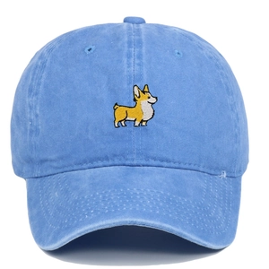 Close-up of embroidered corgi dog detail on sky blue washed cotton baseball cap