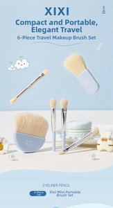 Close-up of portable 6-piece makeup brush set with light blue handles and soft beige bristles