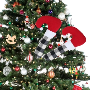 Detail of Christmas elf-style refrigerator handle covers with red and plaid festive patterns