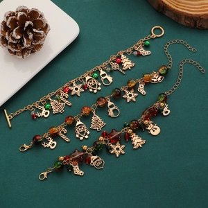 Christmas charm bracelet with gold-plated tree, reindeer, and colorful festive beads