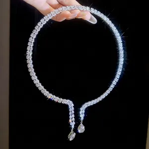 Luxurious double-row zircon choker with pear-cut drop pendants on a black background