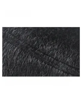 Close-up of fine sewing craft and black faux fur texture on men winter hat