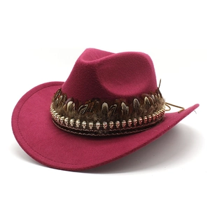 Western wine red wool cowboy hat with layered feathers and golden skull beads decoration