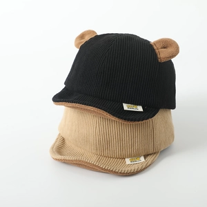 Detail of baby corduroy baseball caps with cute bear ears in black and khaki colors