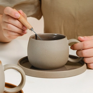 Japanese style stoneware ceramic coffee cup and saucer set in matte beige glaze finish