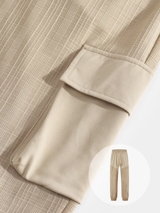 Close-up of casual linen-style pants featuring cargo pocket details and fabric texture