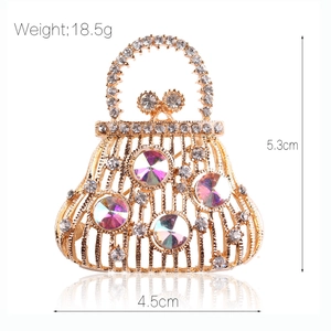 Vintage handbag shape gold brooch with sparkling crystals and iridescent rhinestones