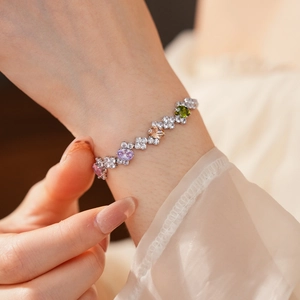 Close-up of zircon irregular bracelet featuring multicolored oval stones on silver band