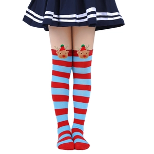 Detail of children's Christmas over-knee socks featuring 3D reindeer doll decorations