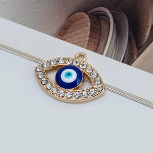 Golden evil eye pendant with blue bead and sparkling white rhinestones for DIY jewelry