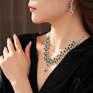 Luxury fashion jewelry set with emerald sunflower pendant necklace and matching earrings