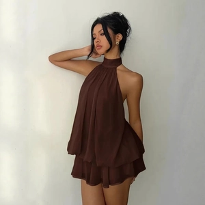 Detail of dark brown halter chiffon dress with tiered ruffles and lightweight fabric