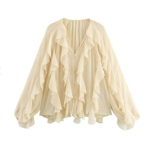 Detail of ruffle layers and deep V-neckline on a beige long sleeve chiffon blouse