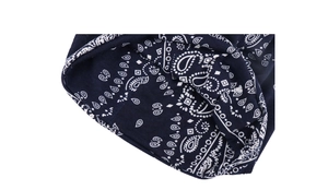 Detail of navy blue cotton paisley beanie showing edge stitching and inner lining texture