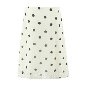 Retro high-waisted A-line midi skirt with black polka dots and ruffle hem on white base