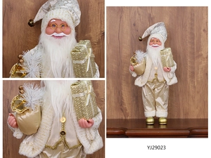 Close-up of champagne gold Santa Claus figurine with sequin robes and gift bag details