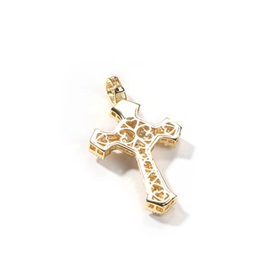 Close-up of golden cross pendant with zircon inlay and hollow heart detail