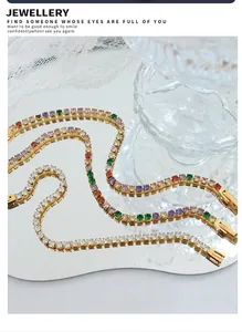 Detailed macro view of three gold-plated tennis bracelets with colorful zircon stones
