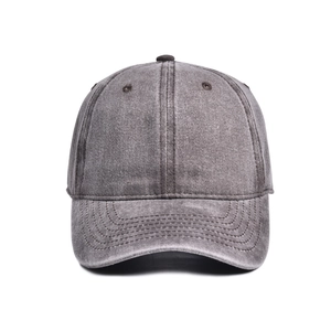 Detail of dark grey washed cotton baseball cap showing reinforced stitching and eyelets