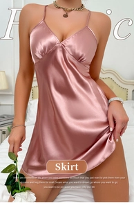 Close-up of pink satin nightdress with thin straps, V-neck, and elegant pleated chest detail