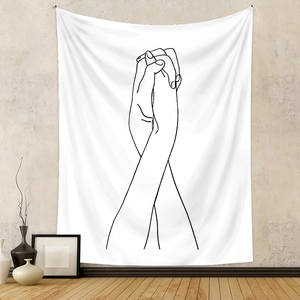 Detail view of a minimalist wall tapestry featuring abstract hand line art in a cozy bedroom
