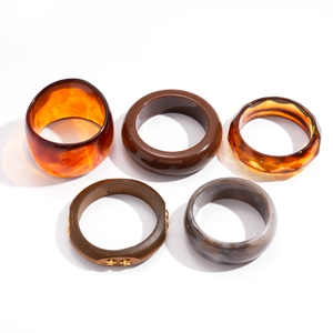 Set of five geometric acrylic resin bracelets in amber, marble, and wood grain textures