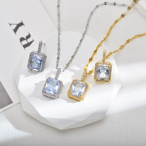 Hip hop jewelry set with square light blue gemstones and micro pave diamonds in silver and gold
