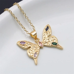 Detail of gold butterfly necklace with purple green and pink crystal stones