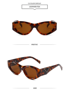 Detail view of leopard print cat-eye sunglasses with golden triangle decor on temple