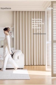 Detailed texture of beige cotton linen blackout curtains with elegant vertical drape