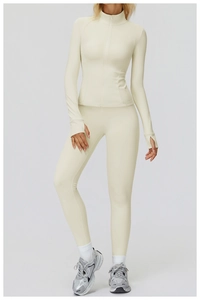 Full body view of women's beige thermal yoga set with slim fit zip jacket and leggings