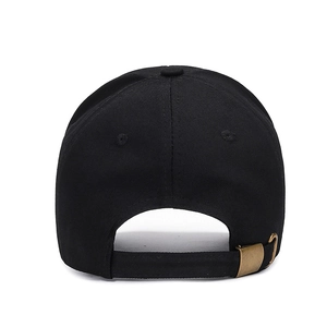 Rear view of minimalist black cotton baseball cap with adjustable antique brass metal buckle