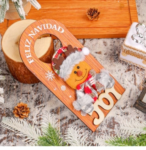 Close-up of wooden Christmas door hanger with a cute plush reindeer and FELIZ NAVIDAD text