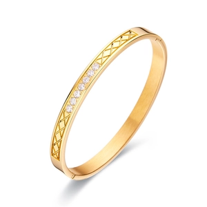 Elegant gold-plated stainless steel bangle with cubic zirconia and quilted pattern