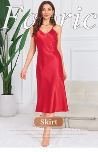 Detailed view of red silk satin slip dress with elegant V-neck and smooth texture