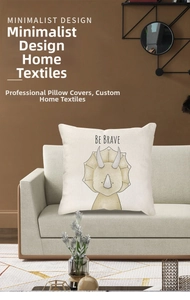 Linen cushion cover featuring a cute triceratops and Be Brave quote on a beige fabric