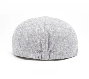 Rear view of light gray linen newsboy cap showing elastic band for adjustable fit