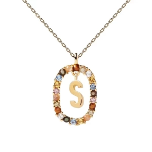 Detail of gold necklace pendant featuring letter S with colorful zircon stones inlay