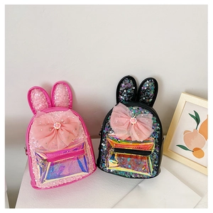 Detail of sequins on a girl's backpack with 3D bunny ears and pink mesh bow