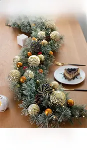 Close-up of 135cm Christmas garland with pine needles, gold ornaments and warm LED lights