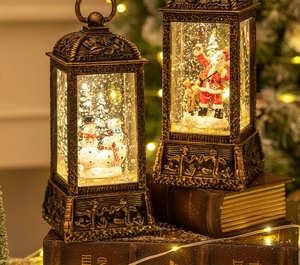 Detail of vintage Christmas lanterns with rotating snowflakes and warm festive glow