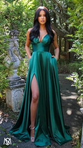 Detail of elegant dark green satin evening gown featuring a deep V-neck and high leg slit